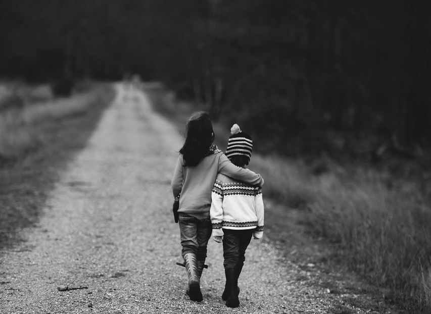 children walking together away from camera